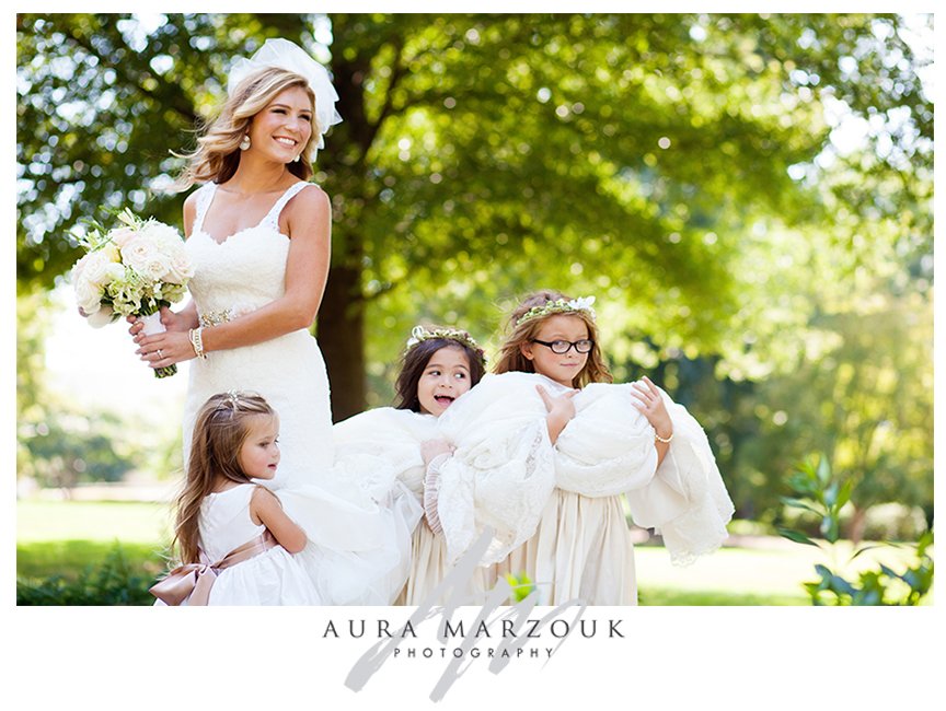 Beautiful flower girls with the bride, with their yellow floral headbands. © Aura Marzouk Photography, Greensboro Wedding Photographer