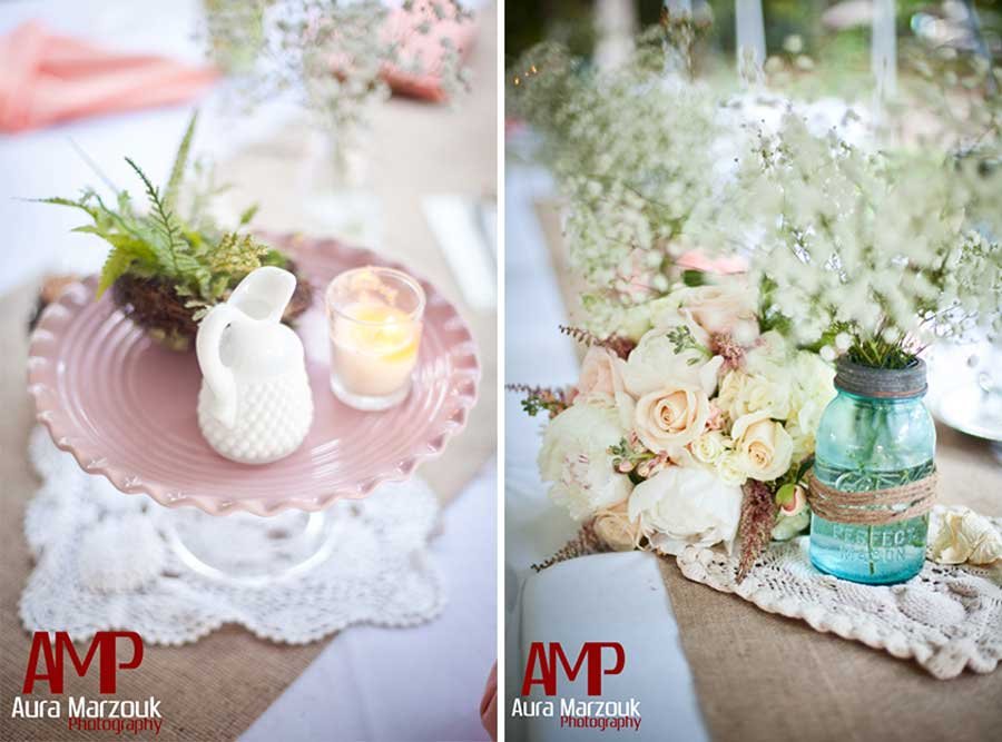 Pink and white antique decor give a rustic vibe to this Seagrove rustic DIY barn wedding. © Aura Marzouk Photography