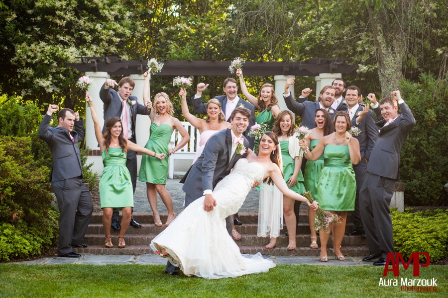 Grey tuxes and green bridesmaid dresses in this wedding party image by Aura Marzouk Photography.