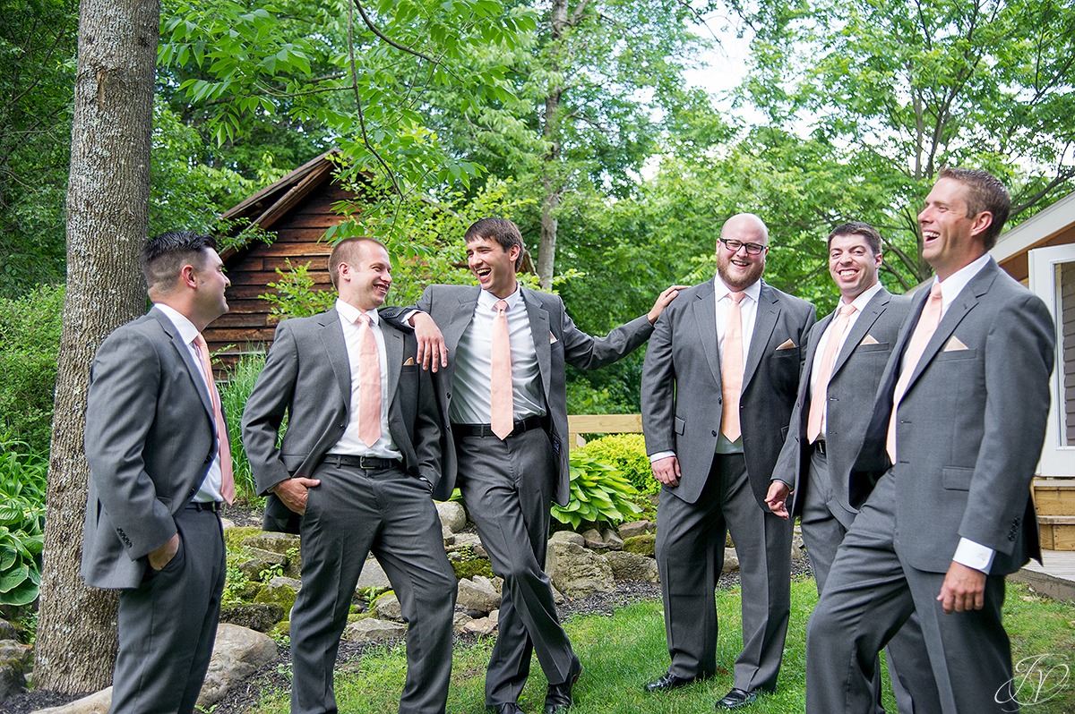 candid fun shot of groom with groomsmen