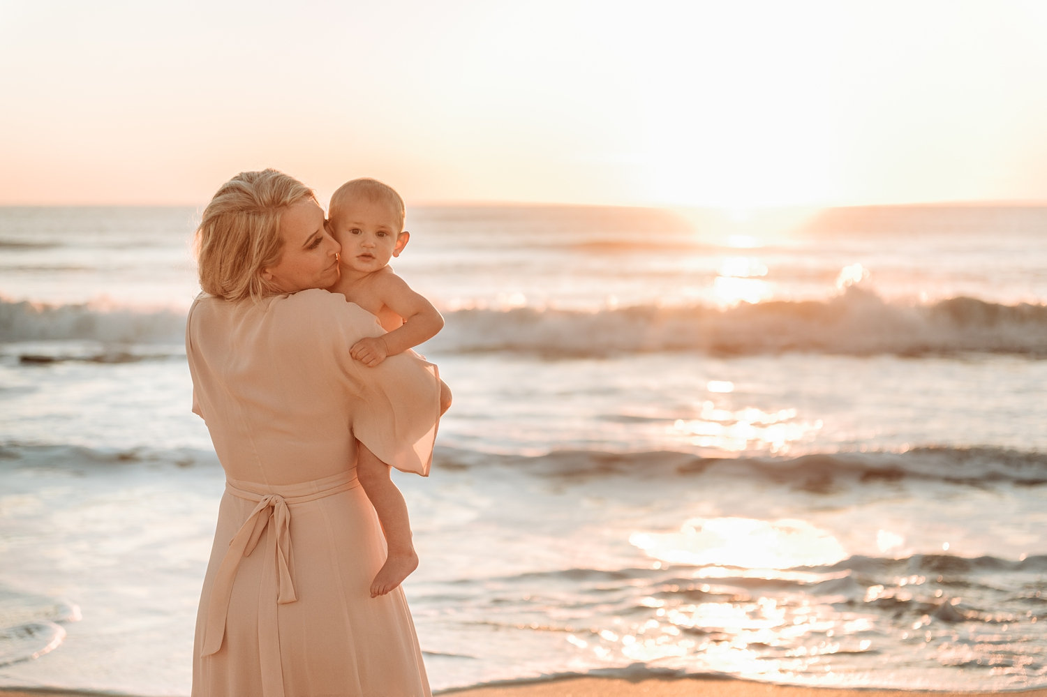 gorgeous mother nuzzling baby boy, sunrise motherhood session in Florida, Ryaphotos Baby Plan member