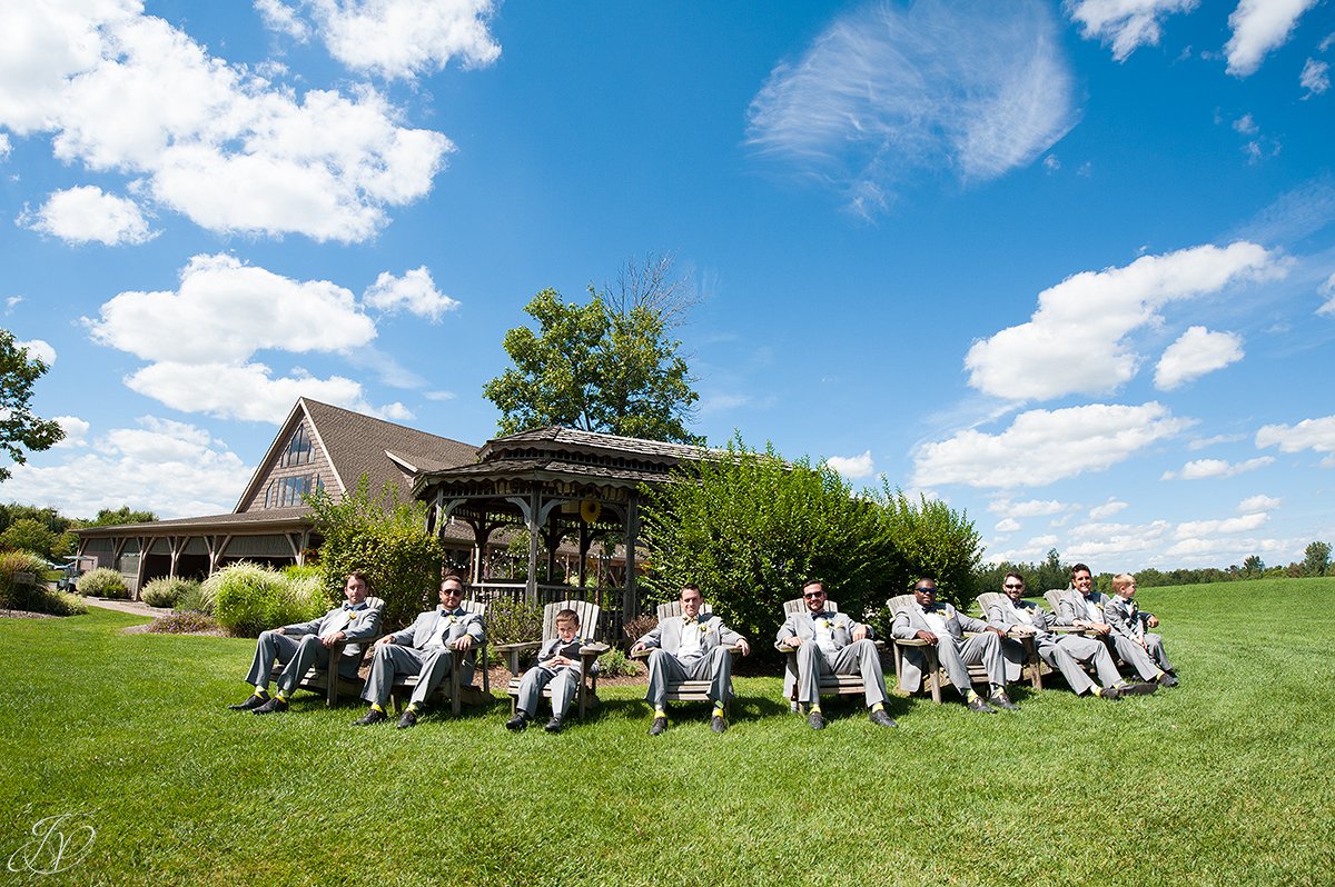 grooms men in bow ties and gray suits