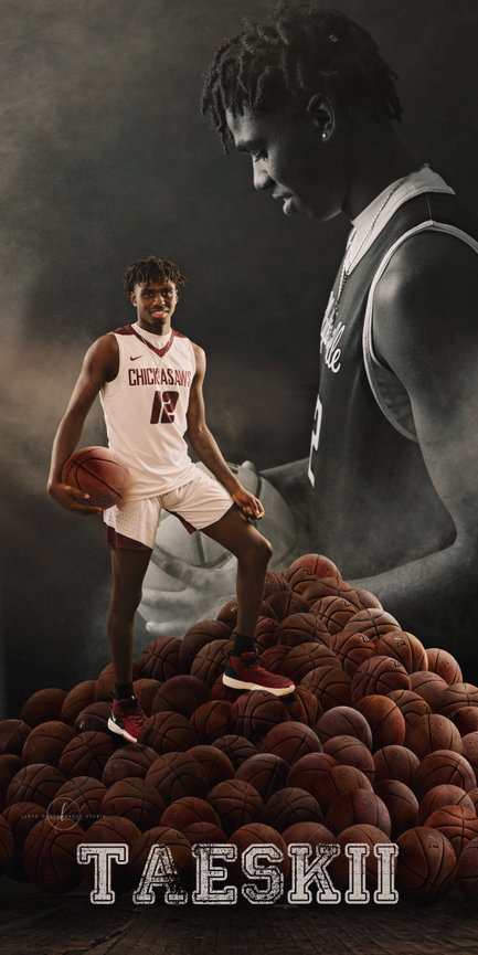 Basketball player in uniform stands atop a pile of basketballs, with a shadowy figure in the background.