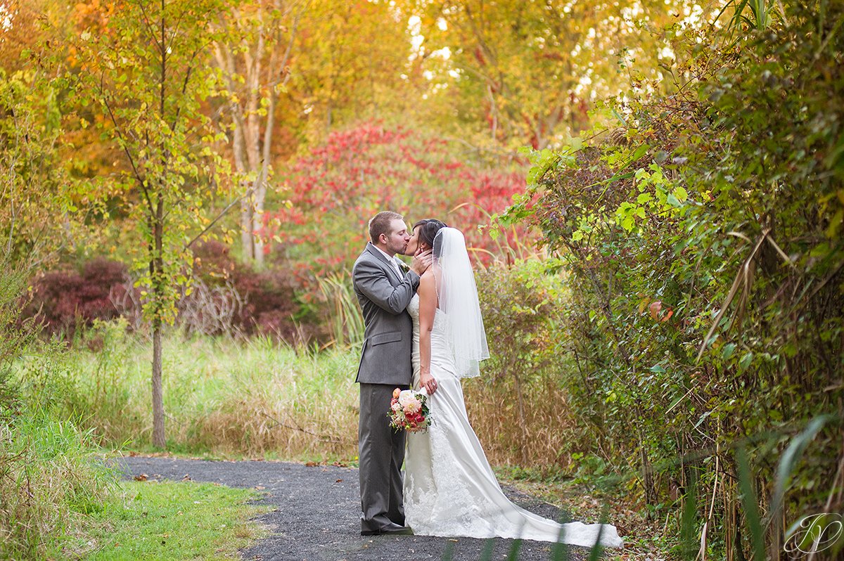 breath taking photo of bride and groom in the fall