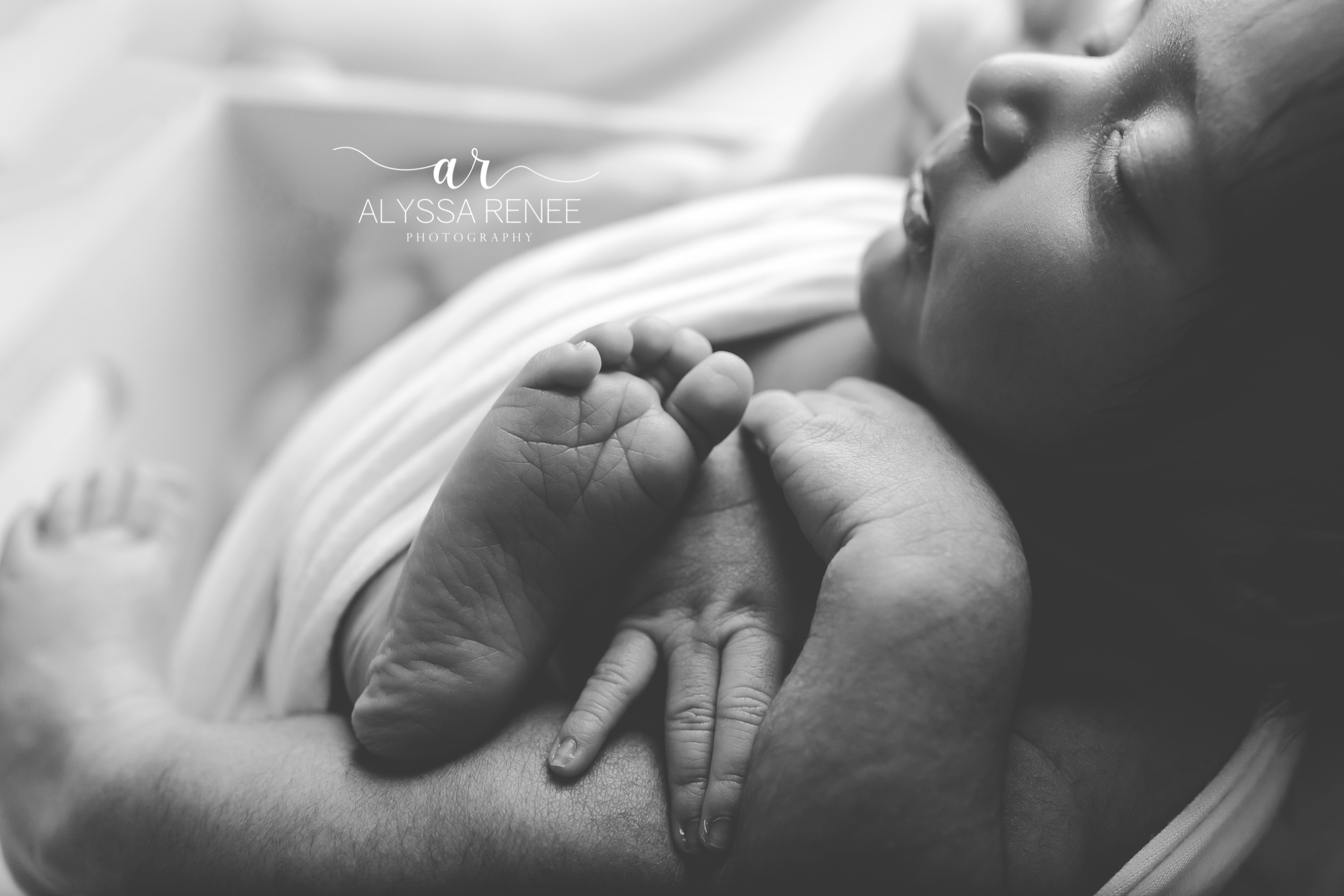 Black and white detail shot of cute baby feet in our jacksonville florida studio