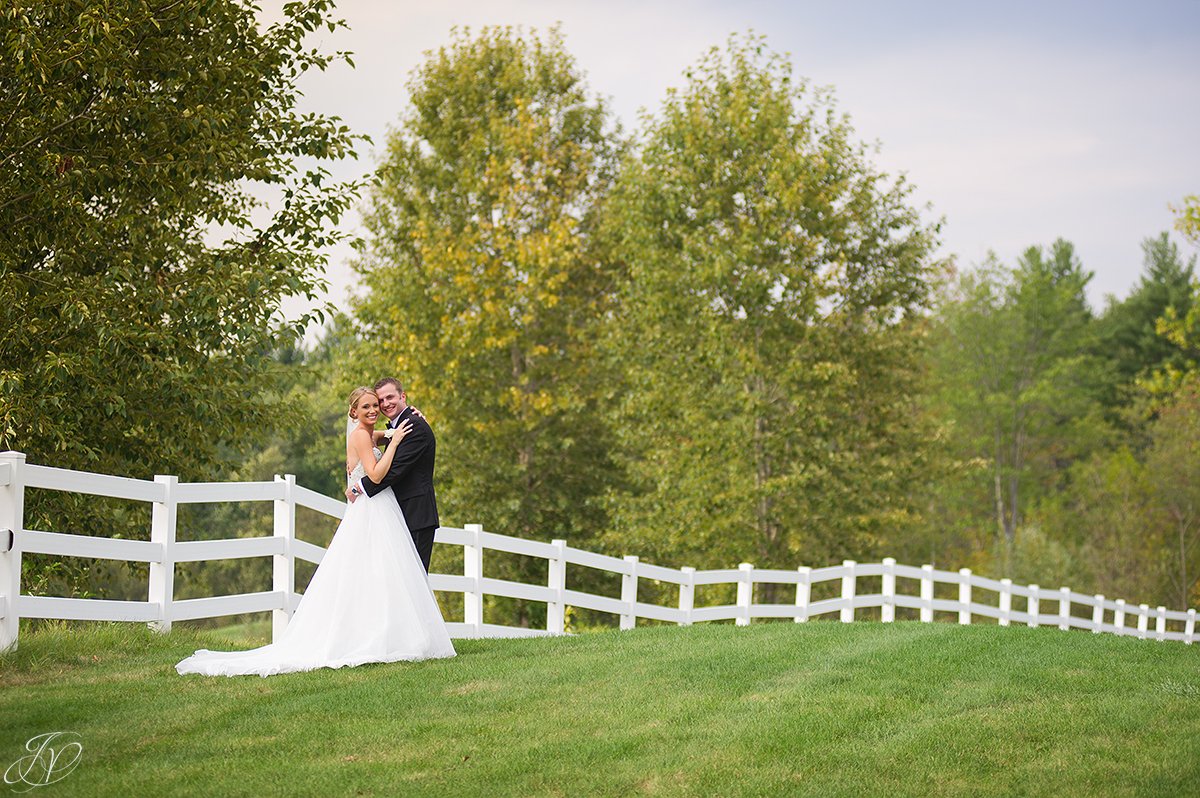 bride and groom white fence saratoga national