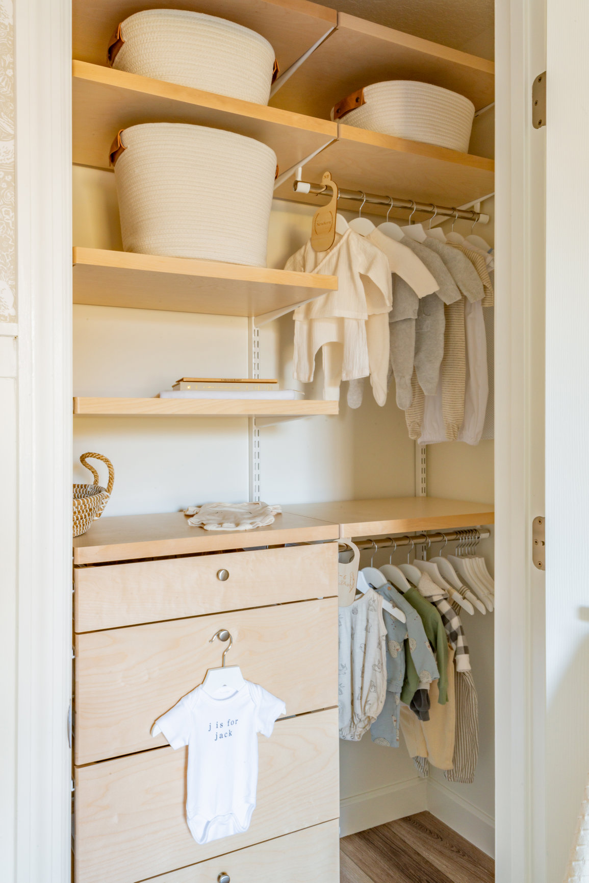 The Container Store closet system in a nursery closet, natural rope baskets