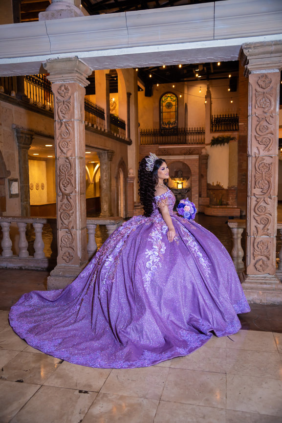 Young woman in purple gown at an elegant venue