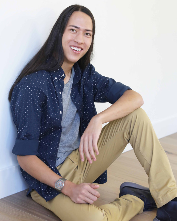 High school senior male artist and musician in his home, . Captured with natural light to reflect creativity, individuality, and timeless style. Luxury senior portrait experience for Colorado families.