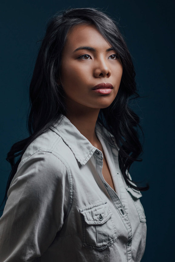 Dramatic denim dressed headshot for a client in studio with lovely makeup styling. Las Vegas professional headshots and team headshots in studio with Adam Trujillo.