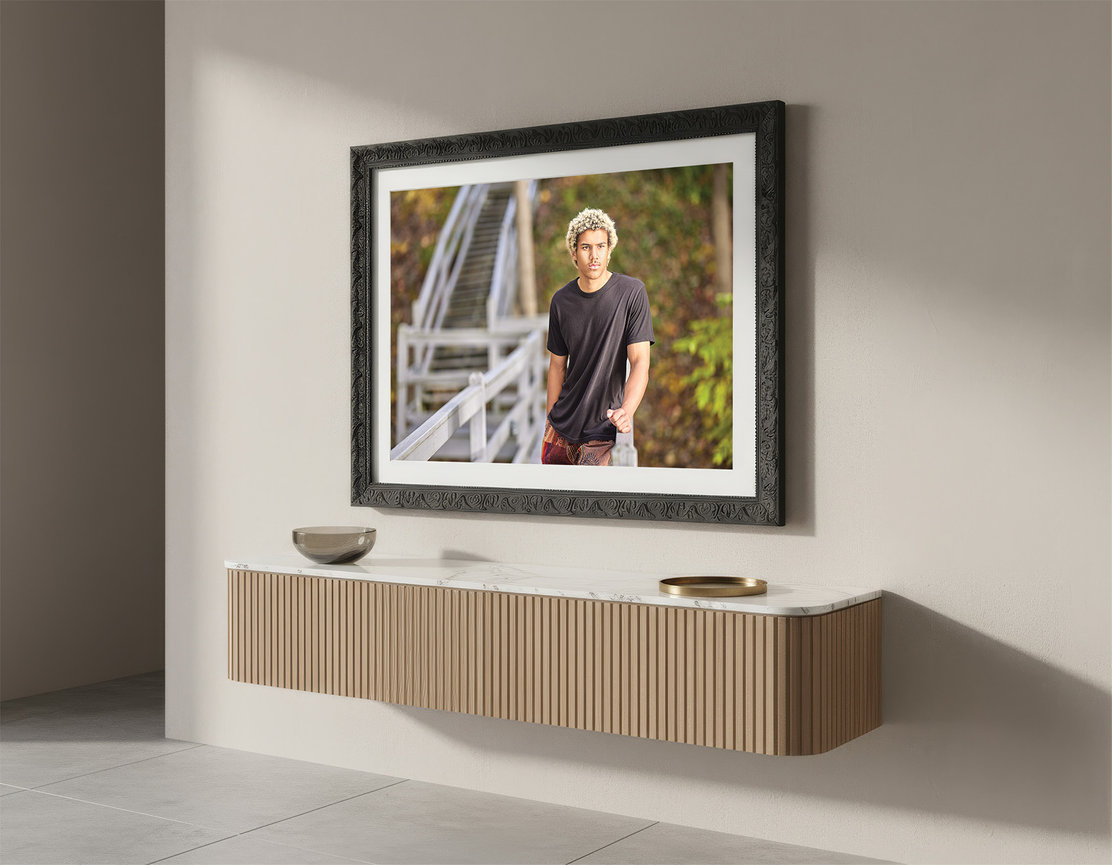 framed portrait artwork displayed as a statement piece above console in a modern home interior