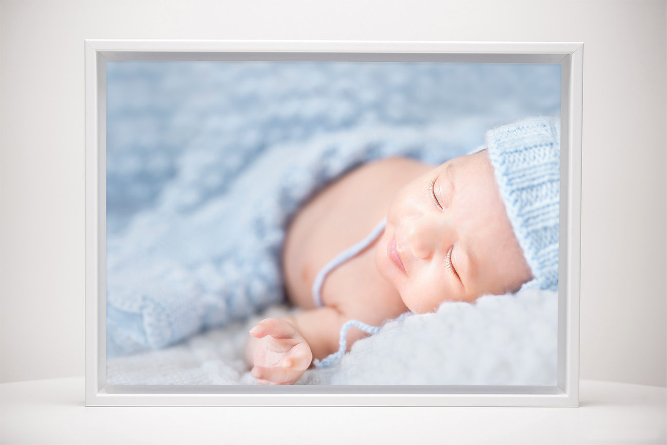 Baby portrait wall art displayed as a soft and timeless statement piece for the home