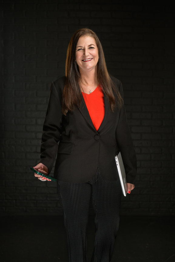 Professional women's portrait photography Orlando - woman in black blazer red top and pinstripe pants holding laptop and phone, She's More Than by Karen K Photo