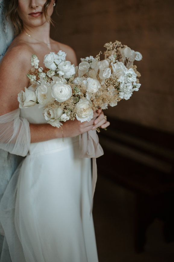 Ethereal moment of love bride hlding her bouquet
