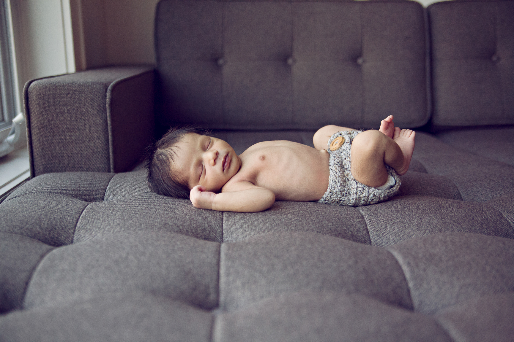 sleeping baby on couch