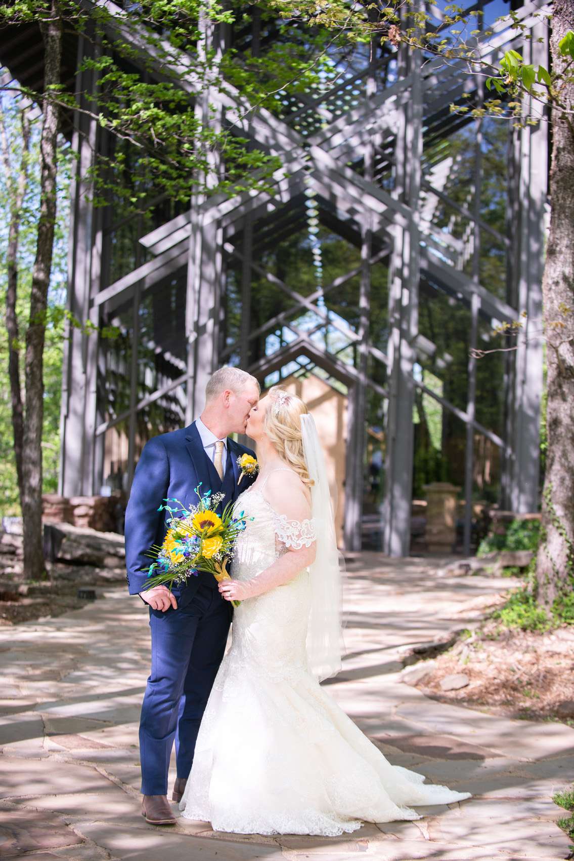Newly married couple in front of Thorncrown Chapel
