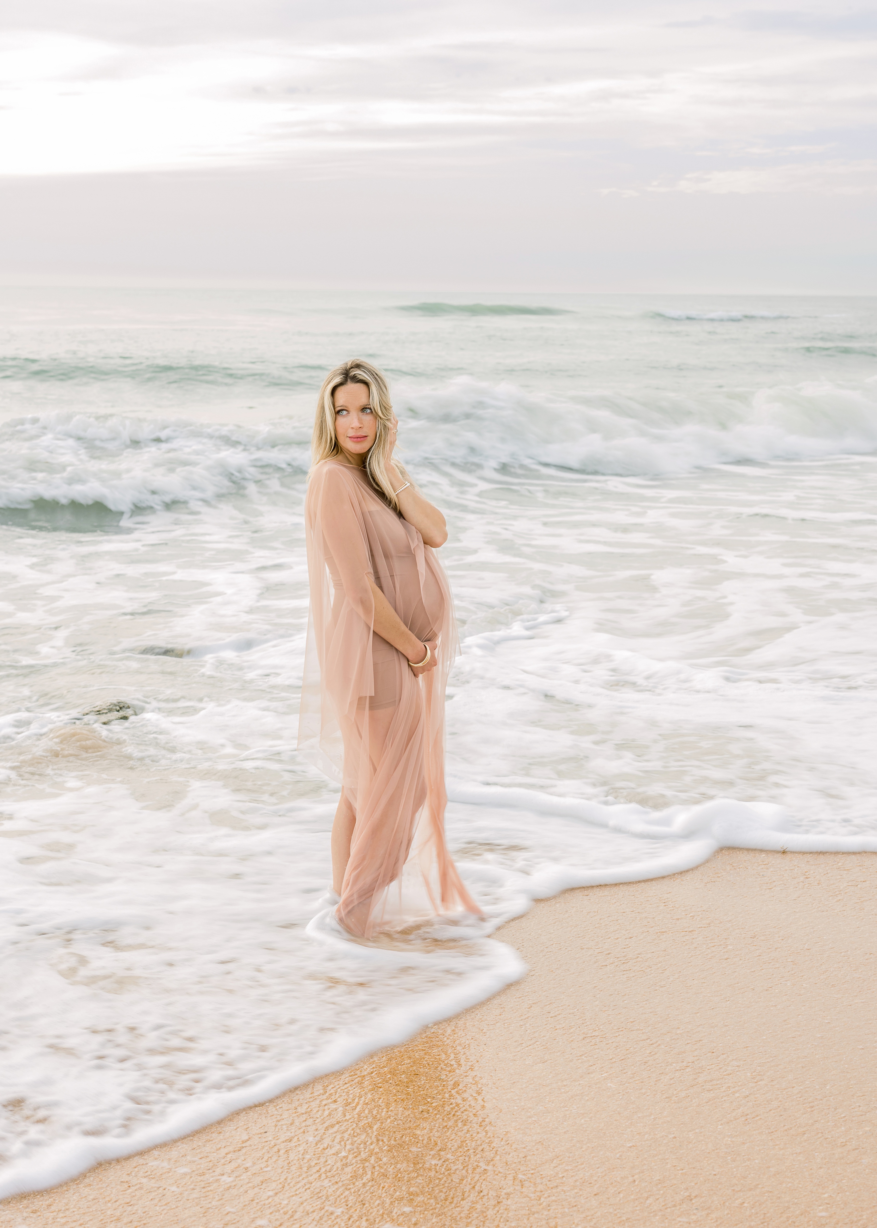 light and airy maternity portrait of woman at St. Augustine Beach Florida