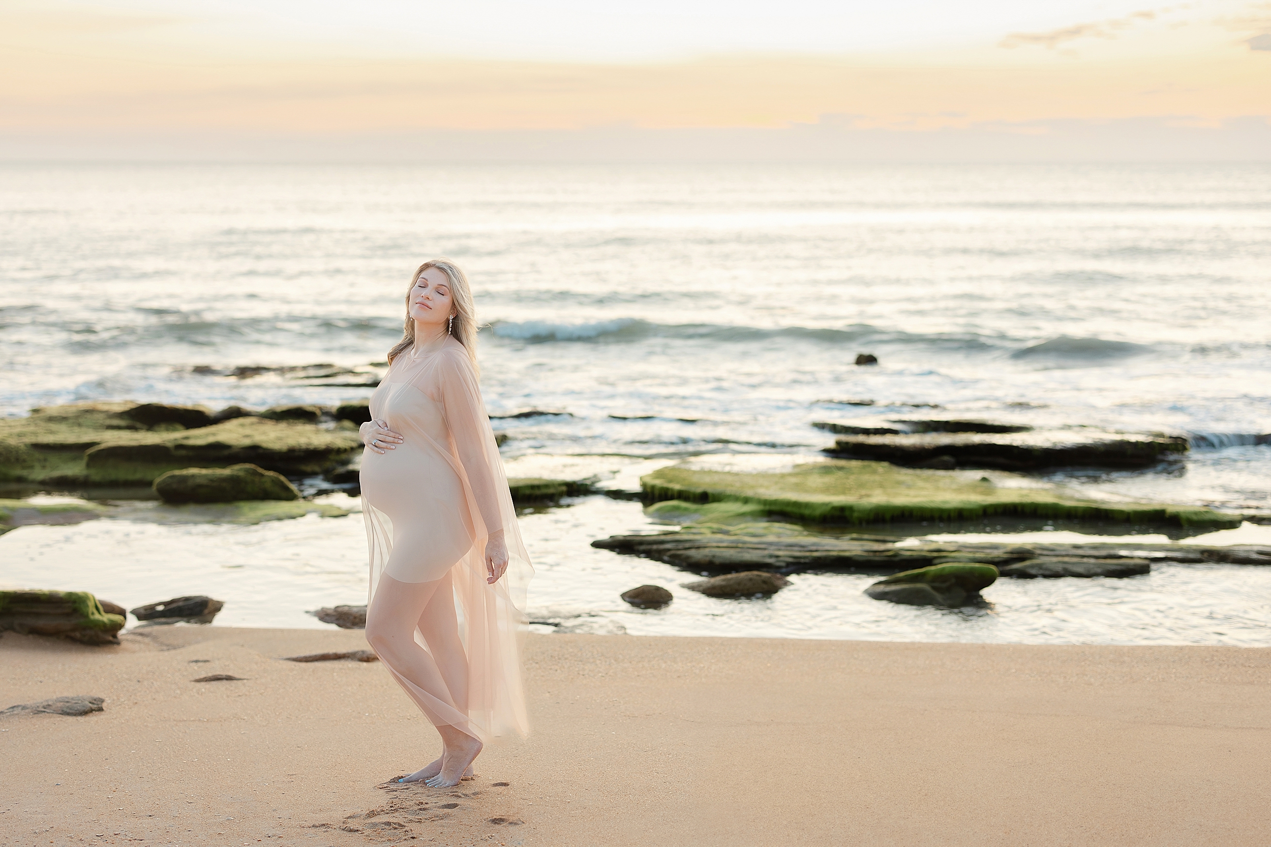 St. Augustine Beach sunrise coastal maternity session with a light and airy look.