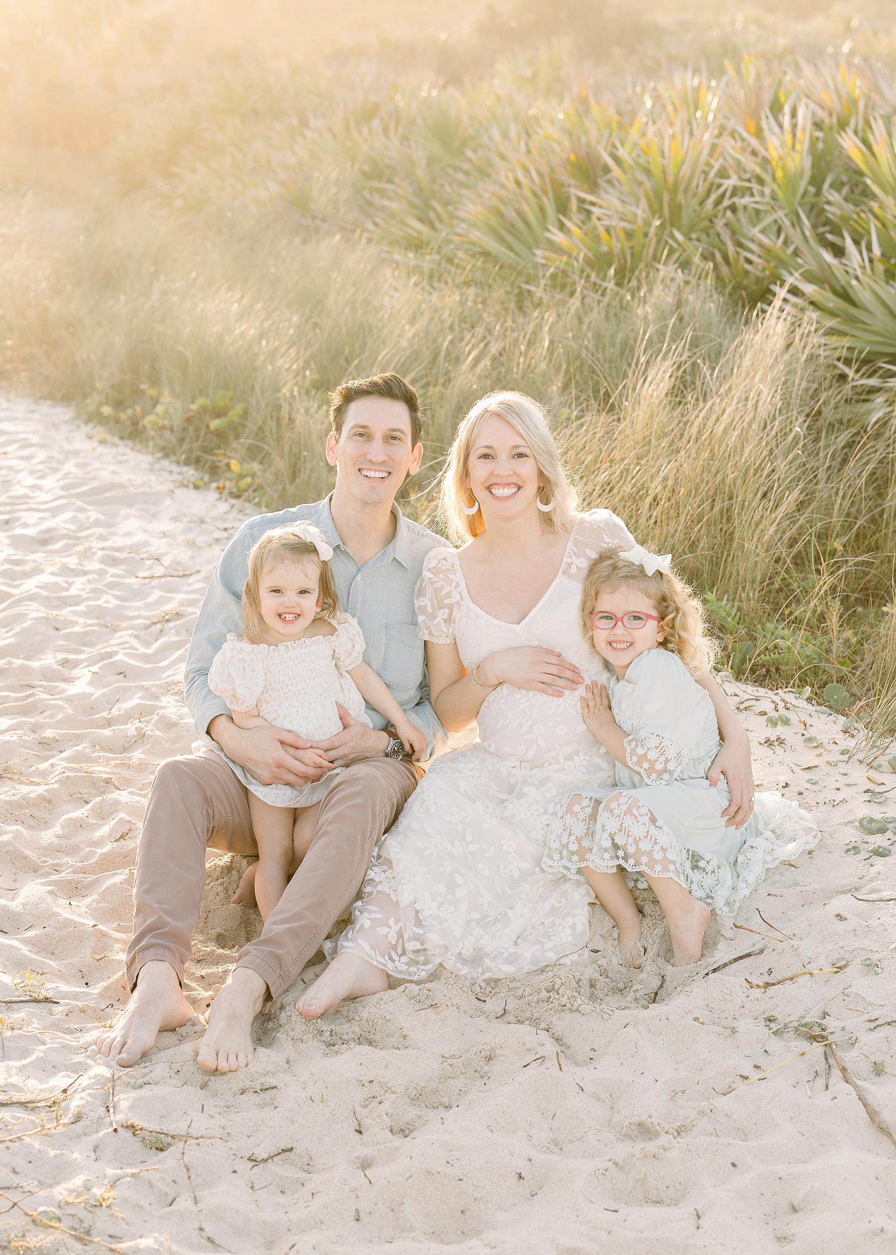 A family beach portrait in St. Augustine Beach at sunset.
