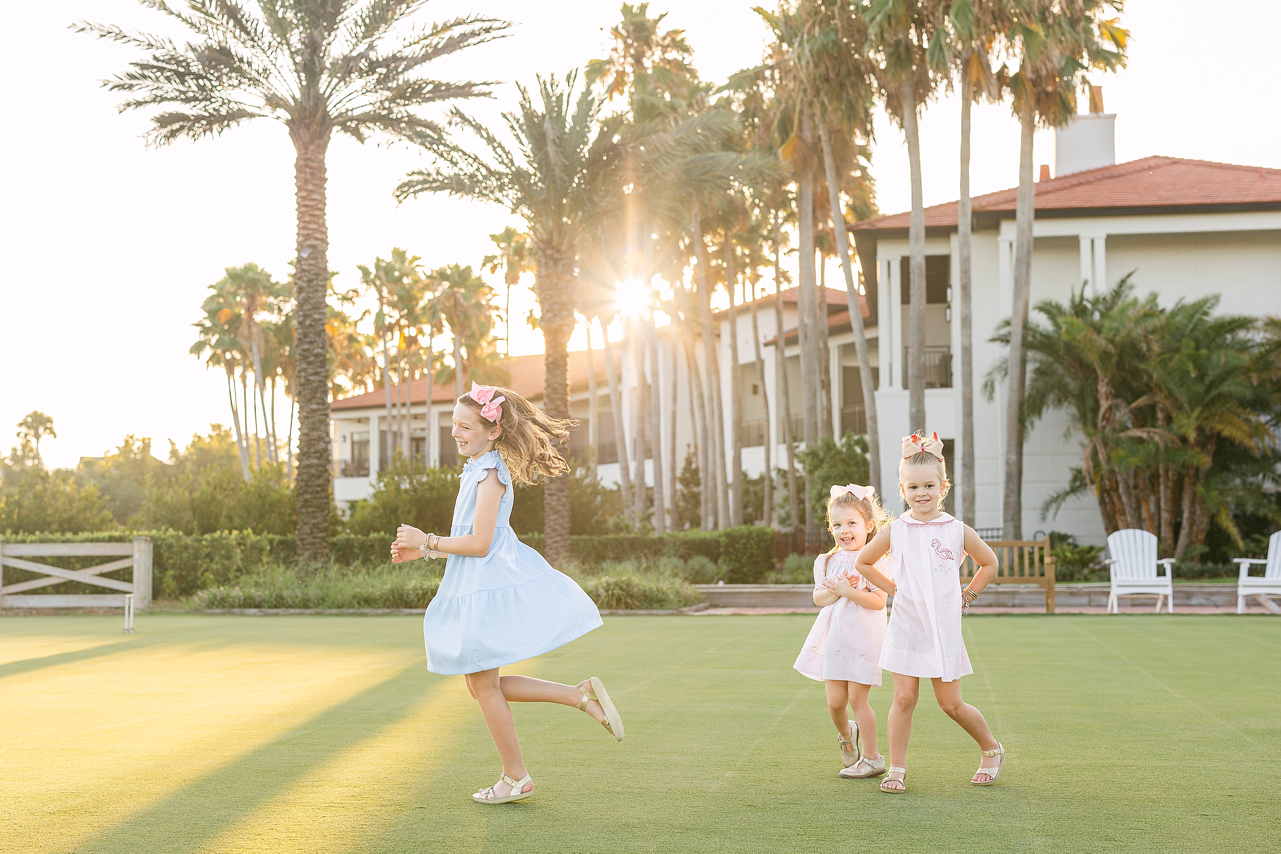 Three little girls play together at sunset on the golf course at Ponte Vedra Inn and Club in Ponte Vedra Beach.