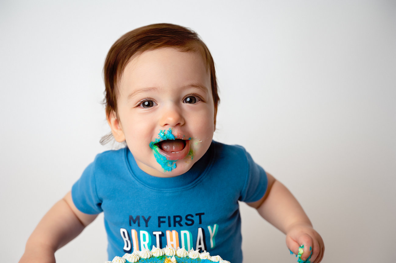 Cake Smash session in La Crosse Wisconsin Happy baby with cake on face