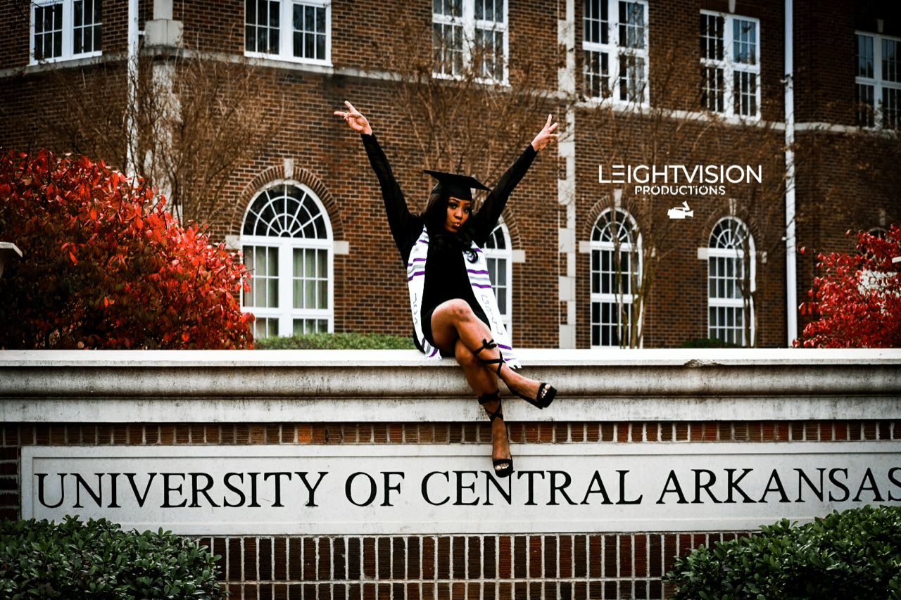 Graduation ceremony at the University of Central Arkansas, showcasing students in caps and gowns celebrating their achievements.