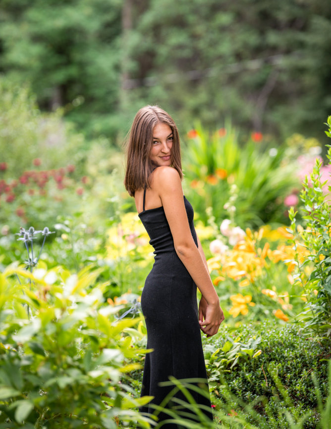 Senior year photo of girl in a flower garden in McCall, Idaho