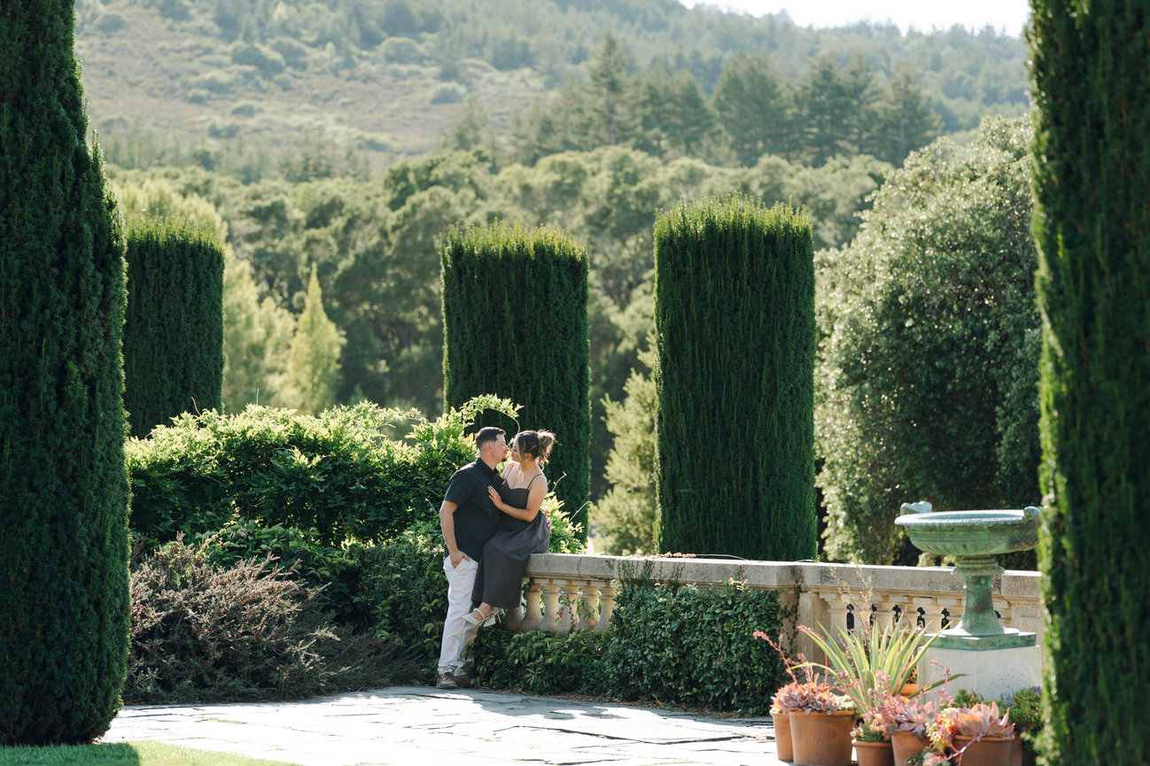 Couple sitting together in a lush garden