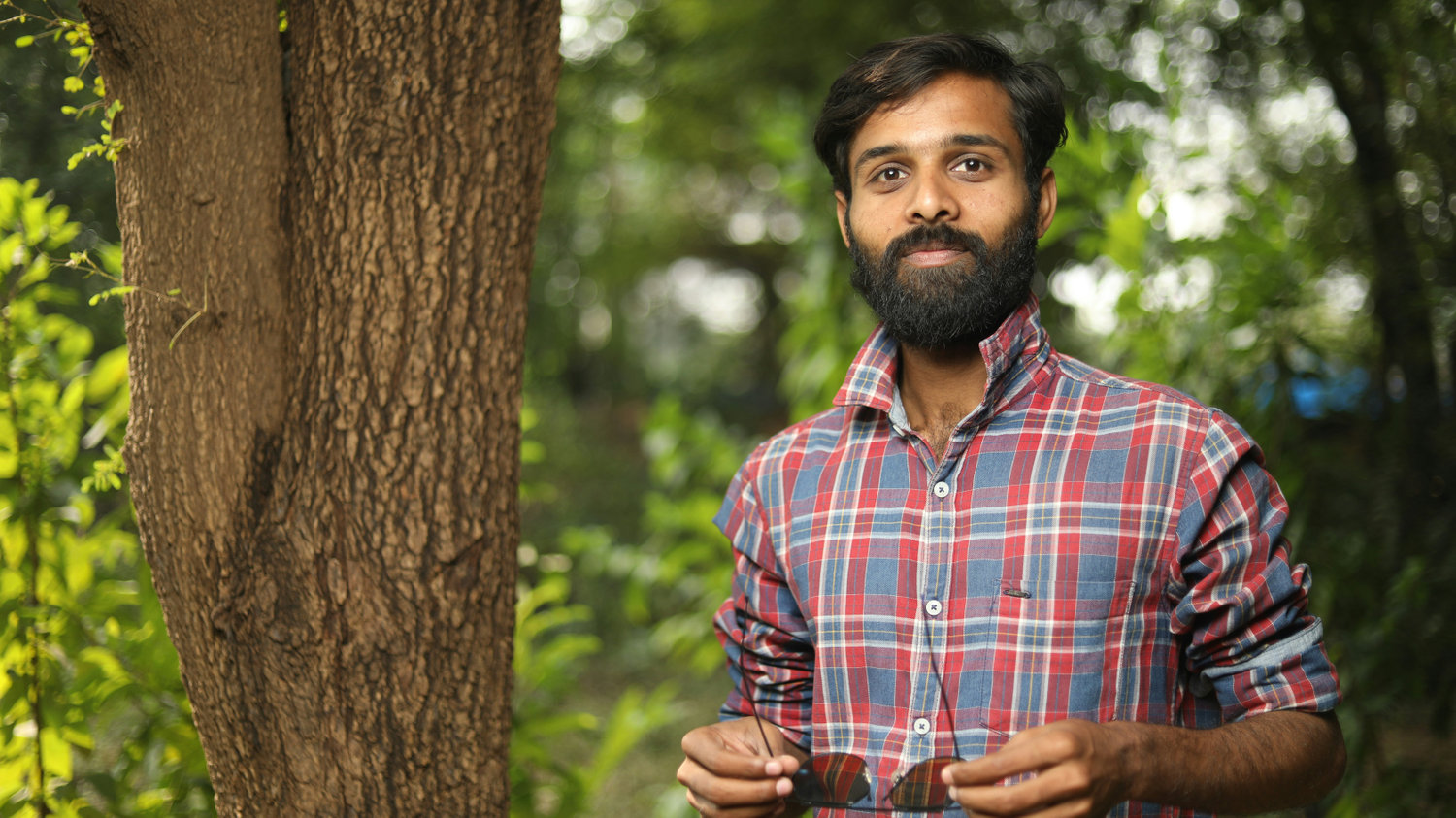 Man standing by tree in park
