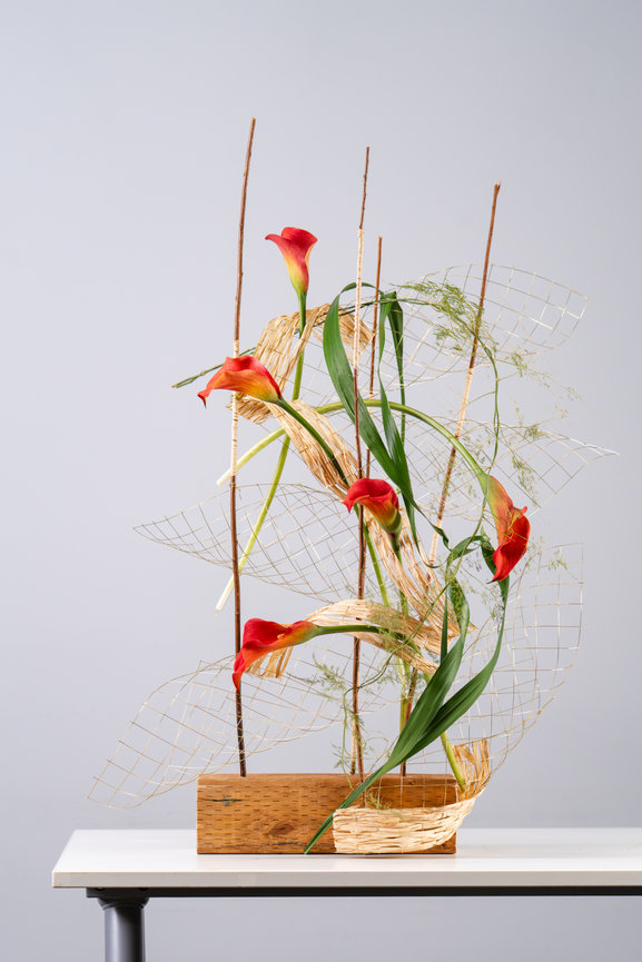 Abstract floral sculpture with red flowers