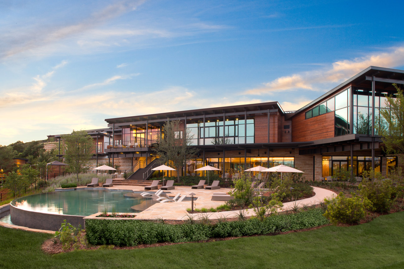 La Canterrra Hotel exterior of spa with well designed pool in foreground in the hills of Texas.