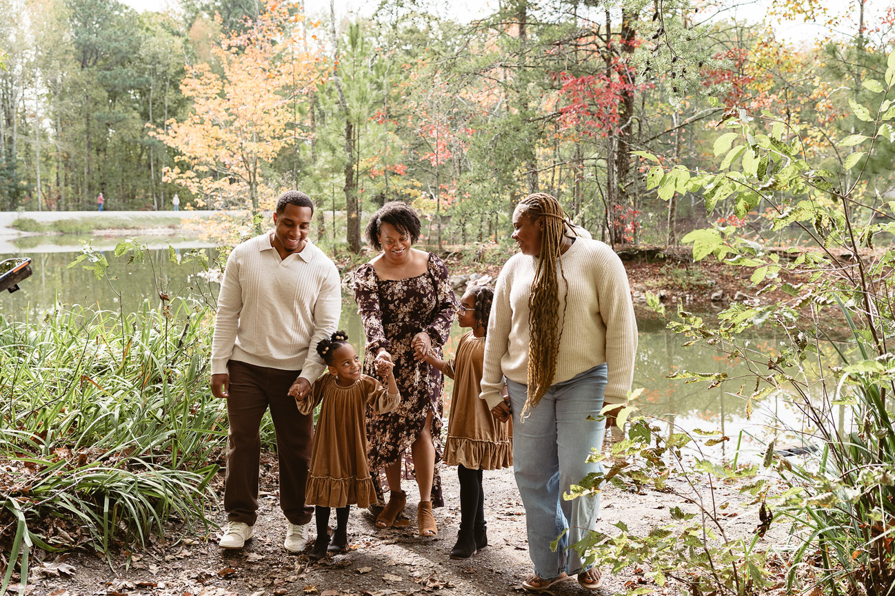 Family of five at a scenic pond