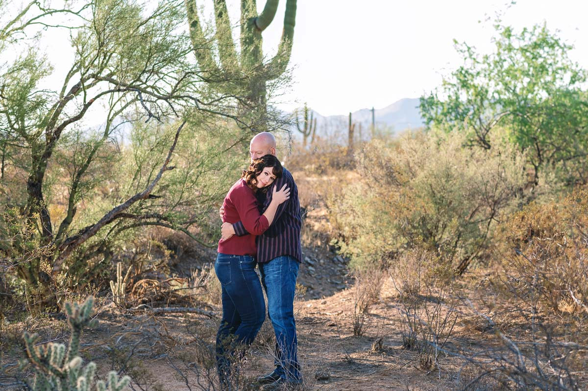 couple hugging in desert landscape