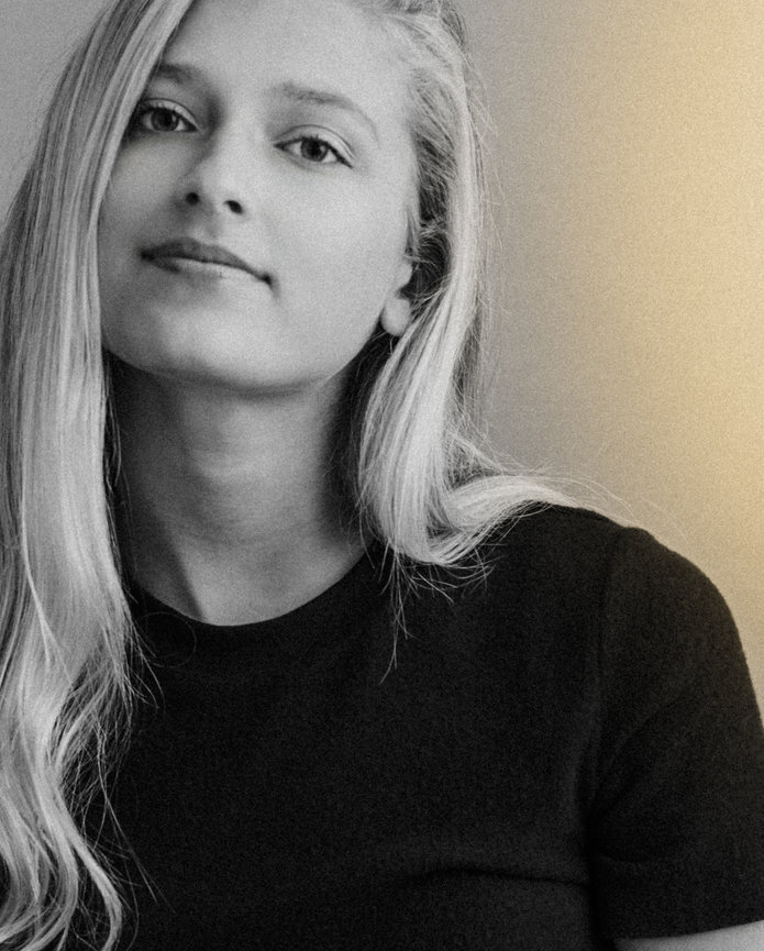 A beautiful blonde young woman poses stylishly for a model and acting headshot