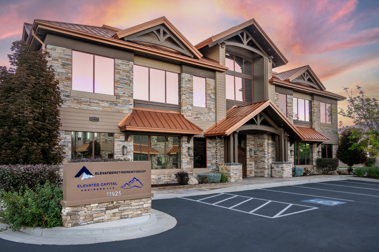 Photography of the exterior of an office building at sunrise.