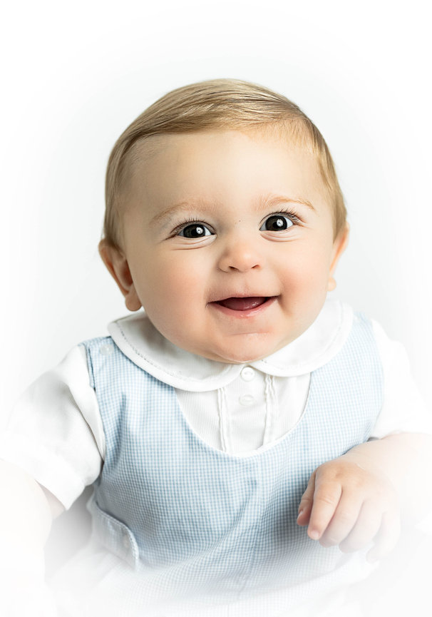 Heirloom baby photo showcasing timeless style and soft studio lighting