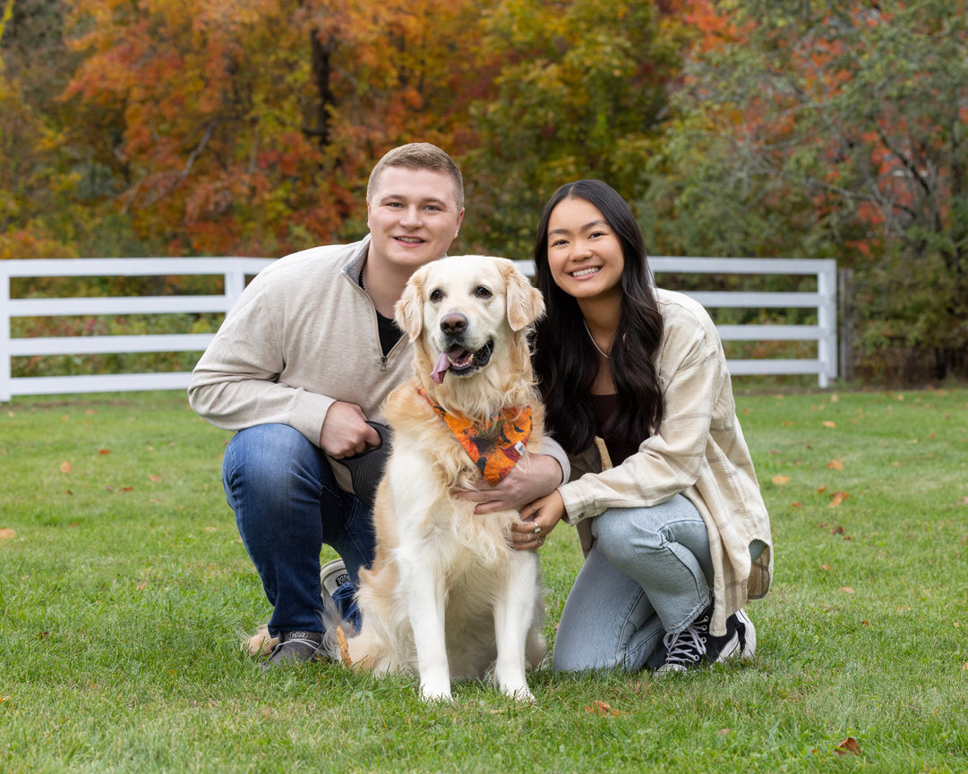 Outdoor autumn  sibling portrait adult brother and high school girls with golden retriever during fall medfield ma
