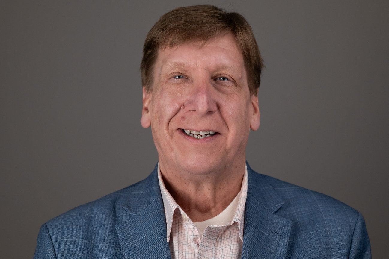 Smiling man in blue blazer