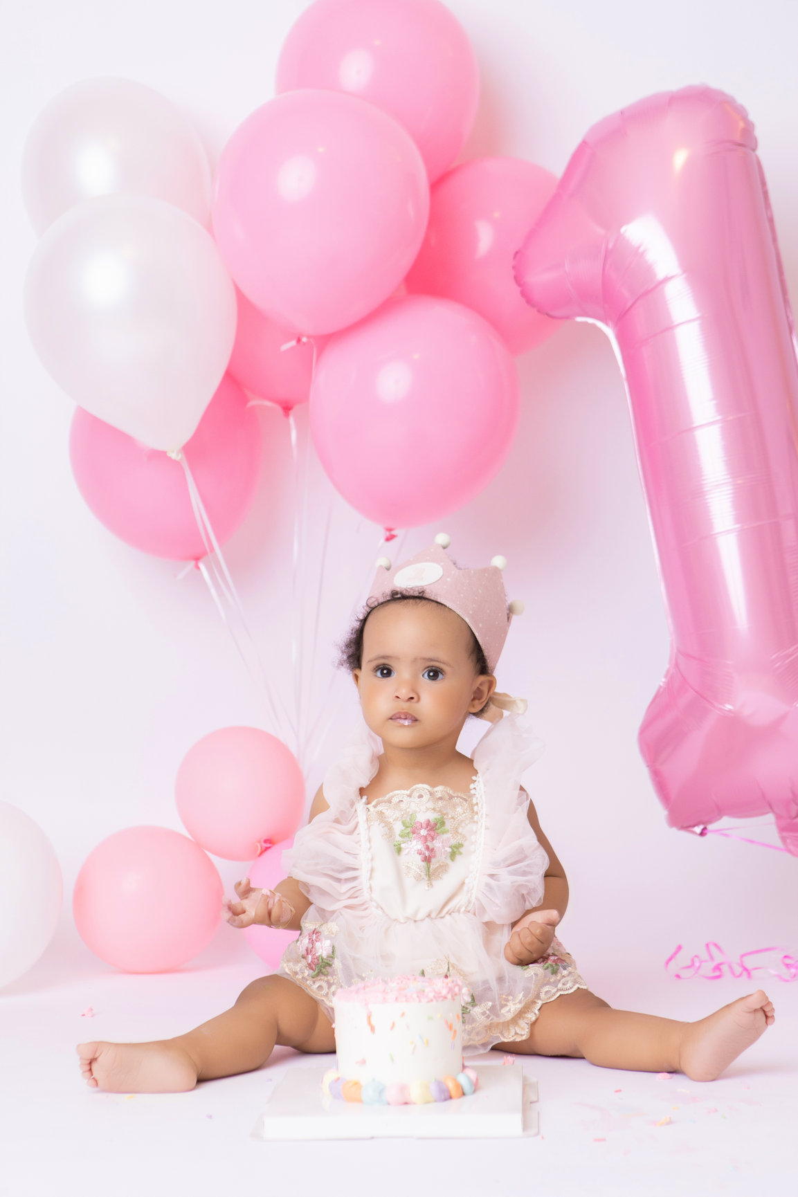 Calgary cake smash photography pink balloons tulle and bubbles first birthday session photo 17