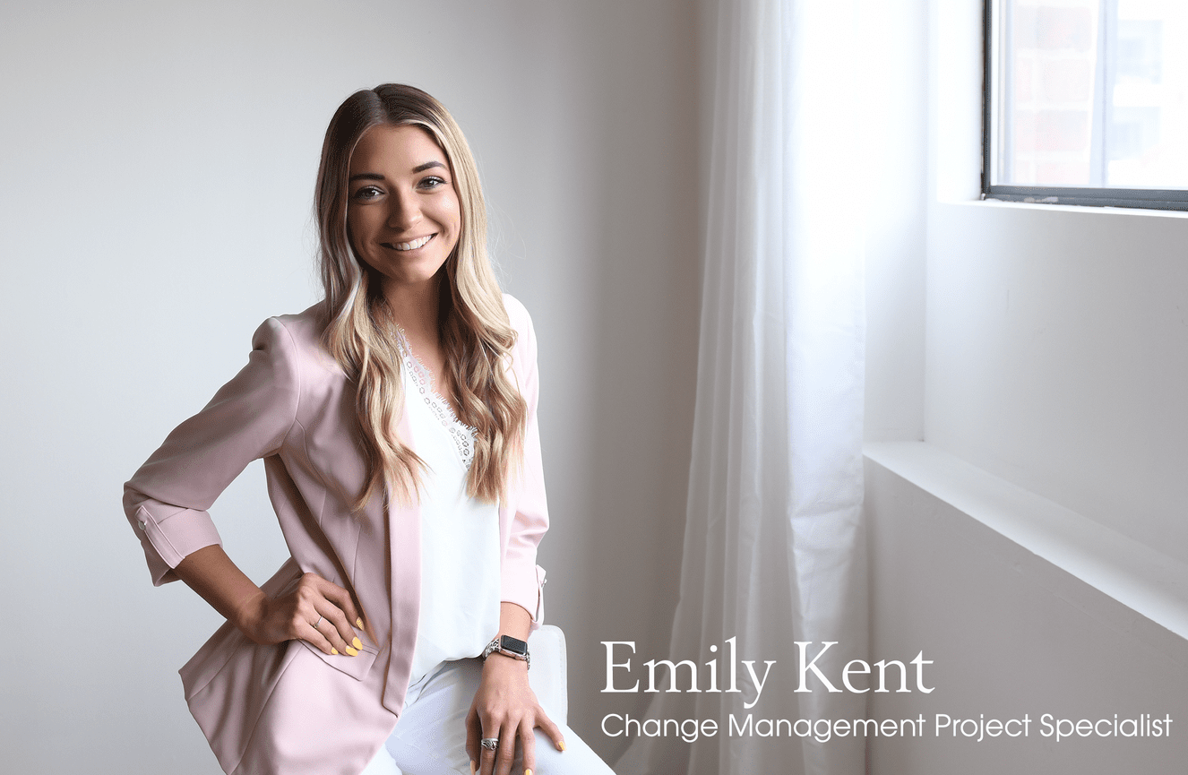 An assured young professional woman in a pink blazer poses for her resume and applications photo at Kliks.