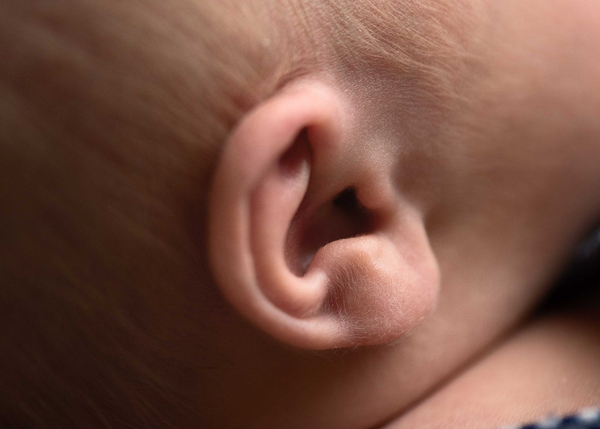 Close-up of newborn baby's ear with fine hair detail – newborn photography in Carpentersville, Illinois
