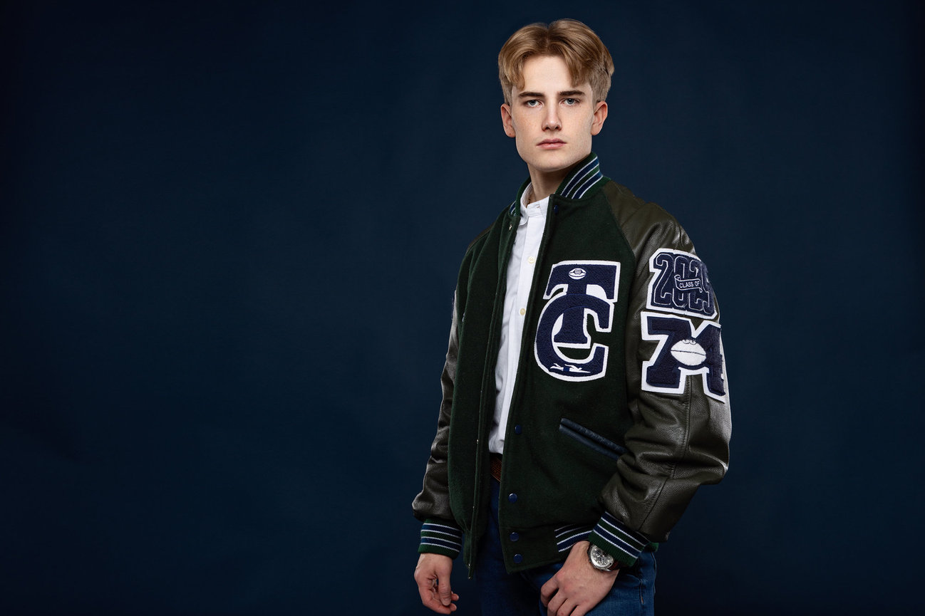 Studio senior session of a guy with letterman's jacket from Aledo.