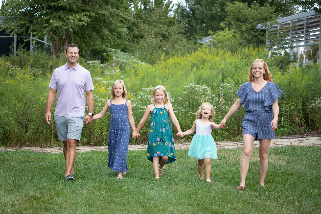 Family walking in a park on a sunny day