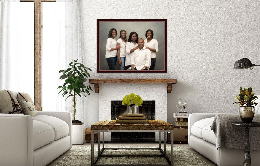 Framed family portrait of parents and 3 teenage daughters displayed above the fireplace